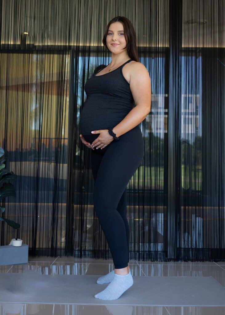 Pregnant lady posing for photo at Perfect Pelvic floor studio