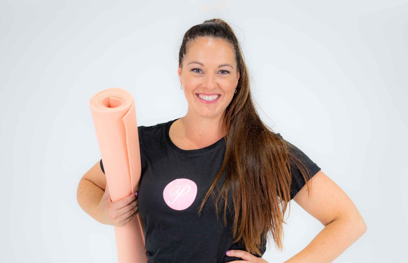 Physiotherapist and owner of Perfec Pelvic Floor, Melanie Platt holding a yoga mat