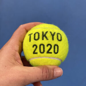 person holding a tennis ball