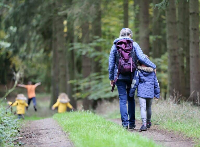 mum walking confidently with her family